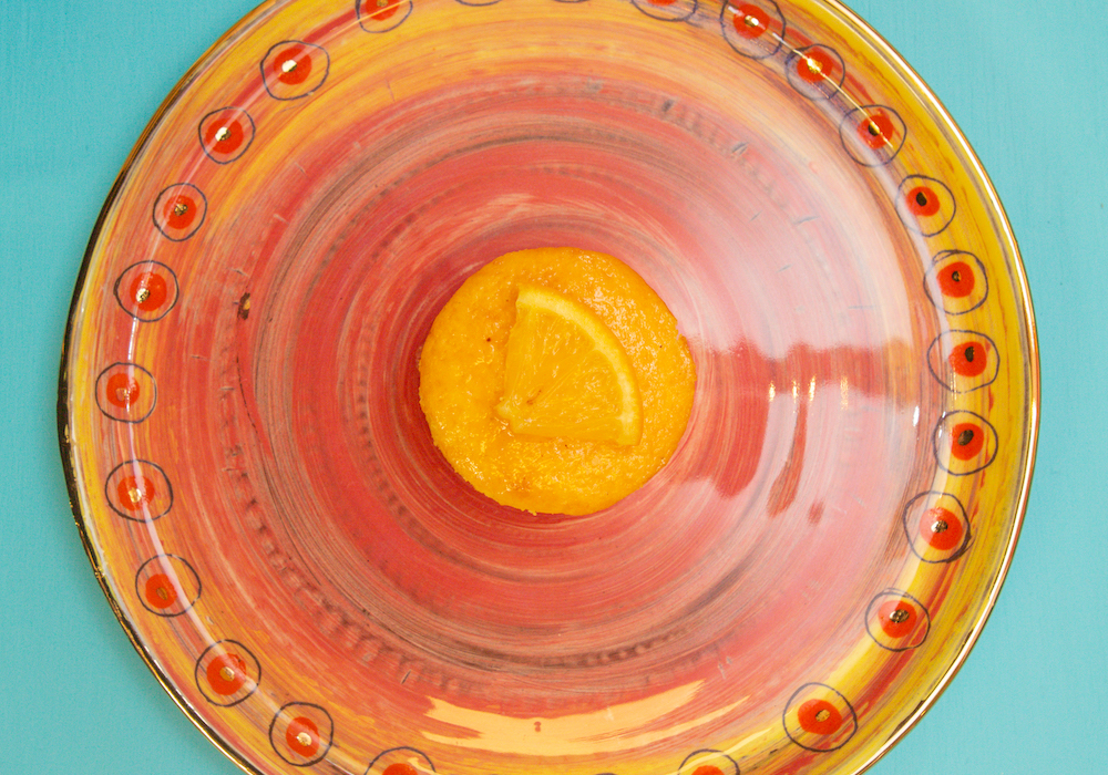 Orange cake on handmade ceramic plate